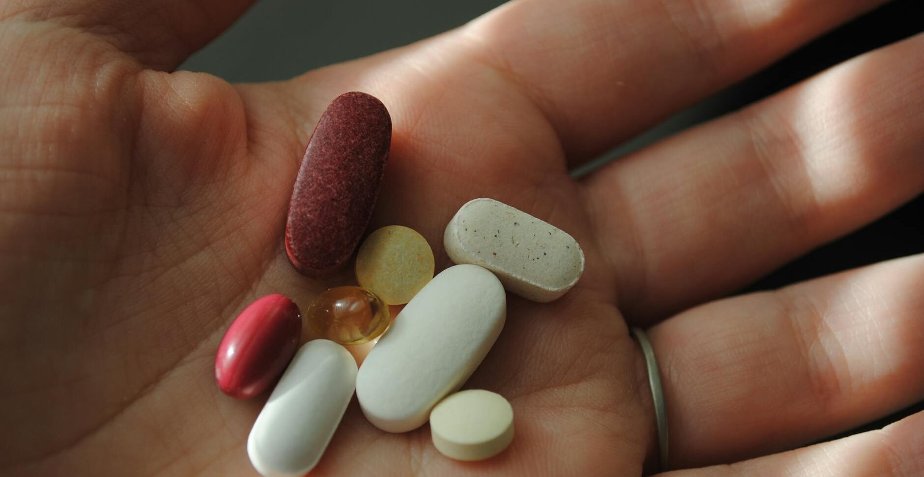 close up shot of a person holding medicines